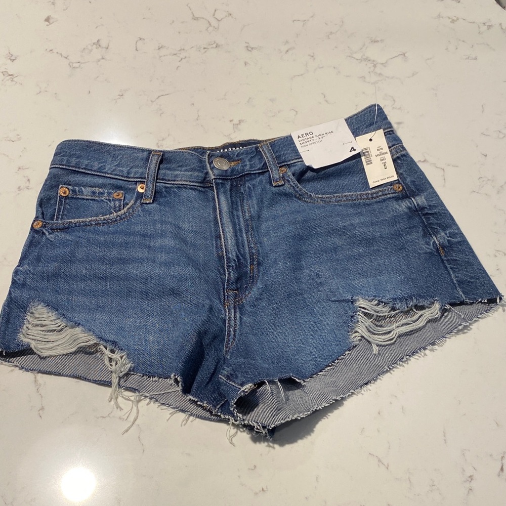 AERO High-Rise Distressed Denim Cutoff Shorts - Blue